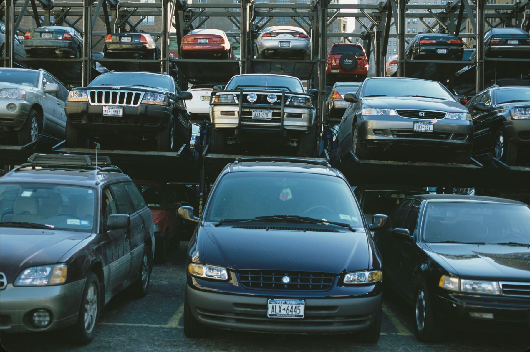 Minivans and SUVs in a Manhattan lot parking garage