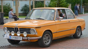 An orange 1970 BMW 2002 at the 6th Ebreichsdorf-Classic Oldtimer Rally