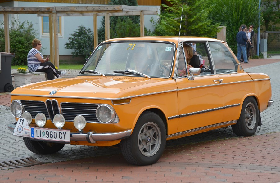 An orange 1970 BMW 2002 at the 6th Ebreichsdorf-Classic Oldtimer Rally