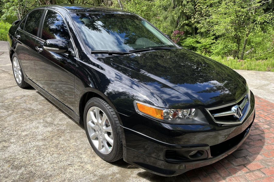 A black 2008 Acura TSX in a driveway