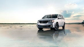 A silver 2019 Dodge Grand Caravan parked near water