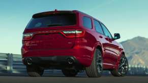 The back of a red 2022 Dodge Durango against a blue sky.