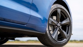 Close up on the tire of a blue 2022 Ford Mustang Stealth Edition