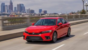 A red 2022 Honda Civic Sedan Touring on the highway