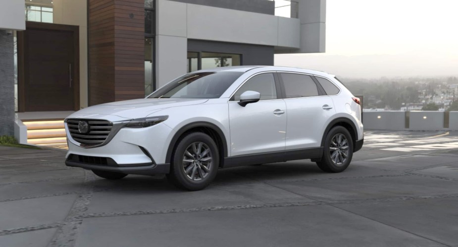 A white 2022 Mazda CX-9 midsize SUV is parked. 