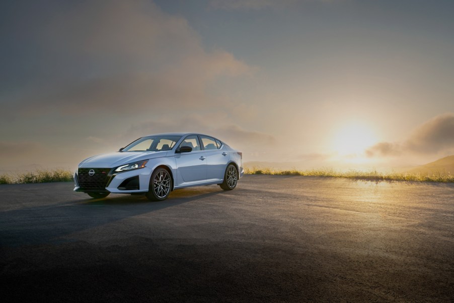 2022 Nissan Altima posing in front of a sunset.