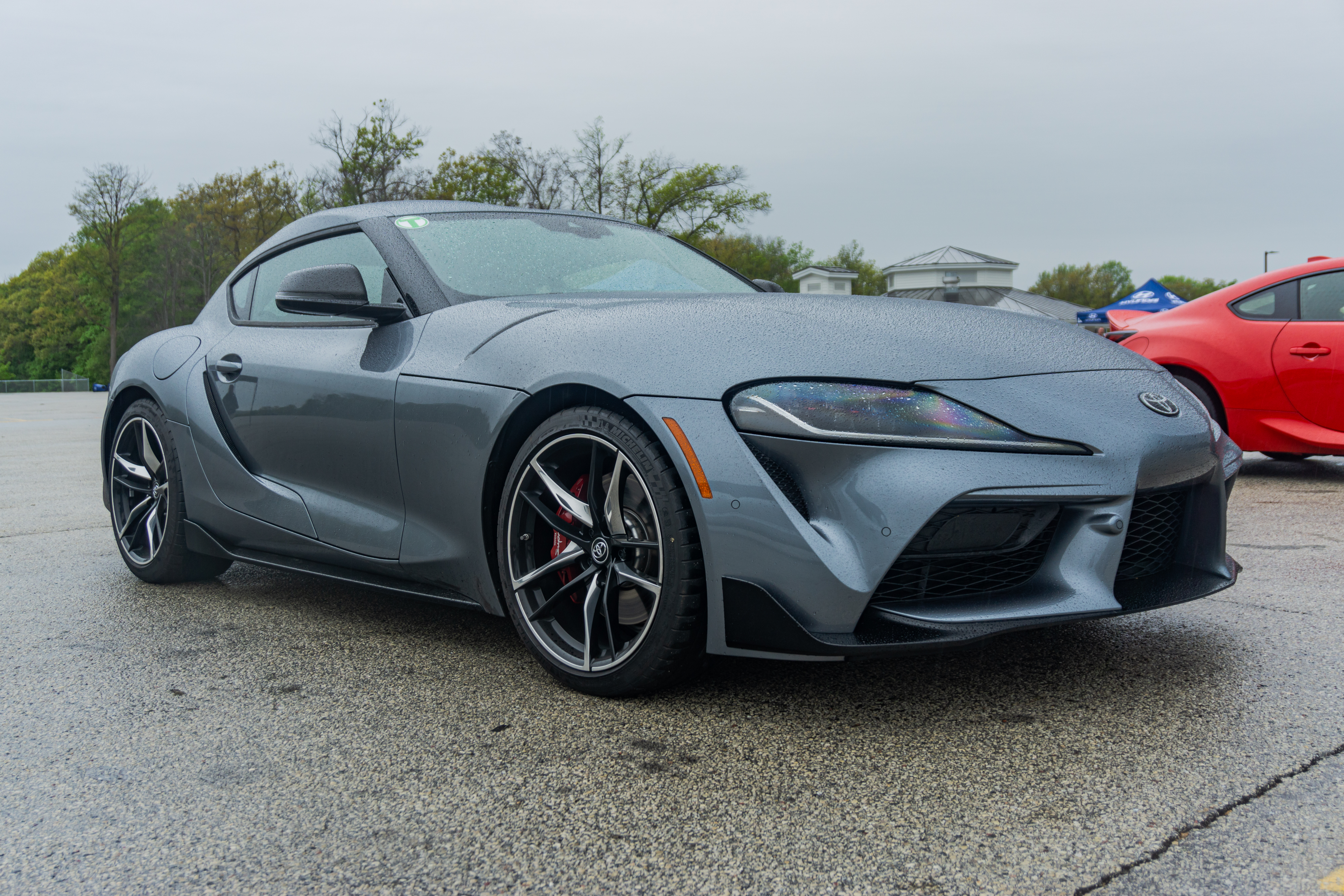 A gray 2022 Toyota GR Supra 3.0 Premium in Road America's parking lot