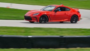 A red 2022 Toyota GR86 Premium cornering around Road America's autocross course