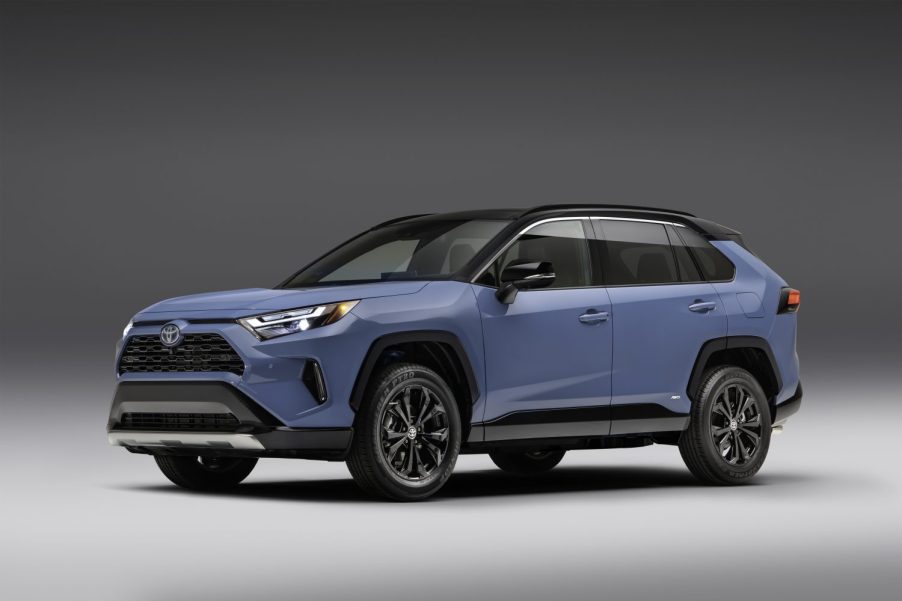 A pale blue 2022 Toyota RAV4 against a gray background.