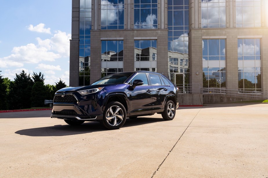 A 2022 Toyota RAV4 Prime small SUV parked in front of a building