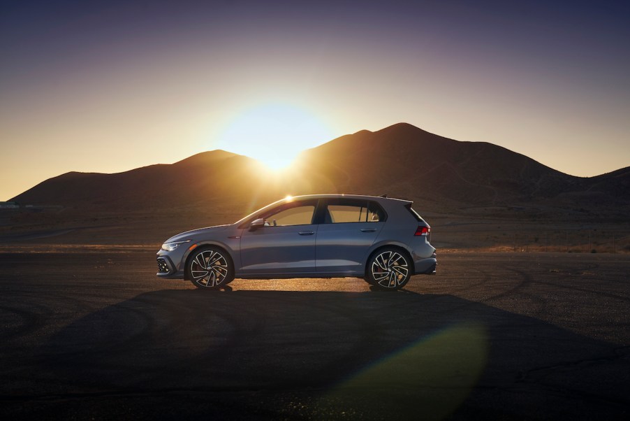 The 2022 Volkswagen GTI side view in the middle of a desert.