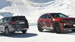 two 2022 Hyundai Santa Fe SUVs in the snow