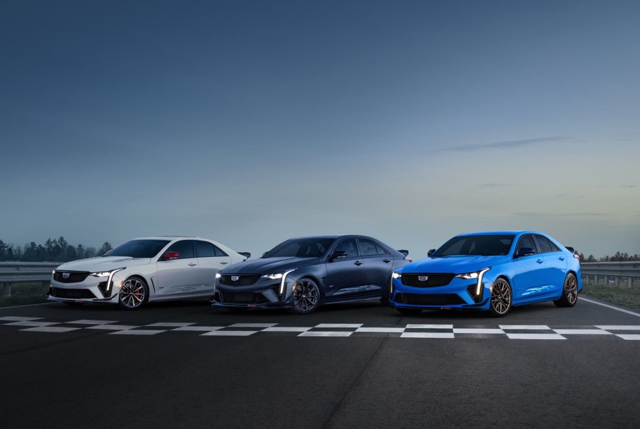 A white, black, and blue 2023 Cadillac CT4-V Blackwing Track Edition on a racetrack