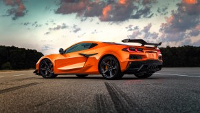 An orange 2023 Chevrolet Corvette Z06 supercar parked at dusk