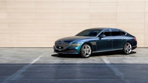 A blue 2023 Genesis G80 parked