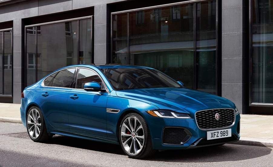 A blue 2023 Jaguar XF P300 R-Dynamic SE parked in a city