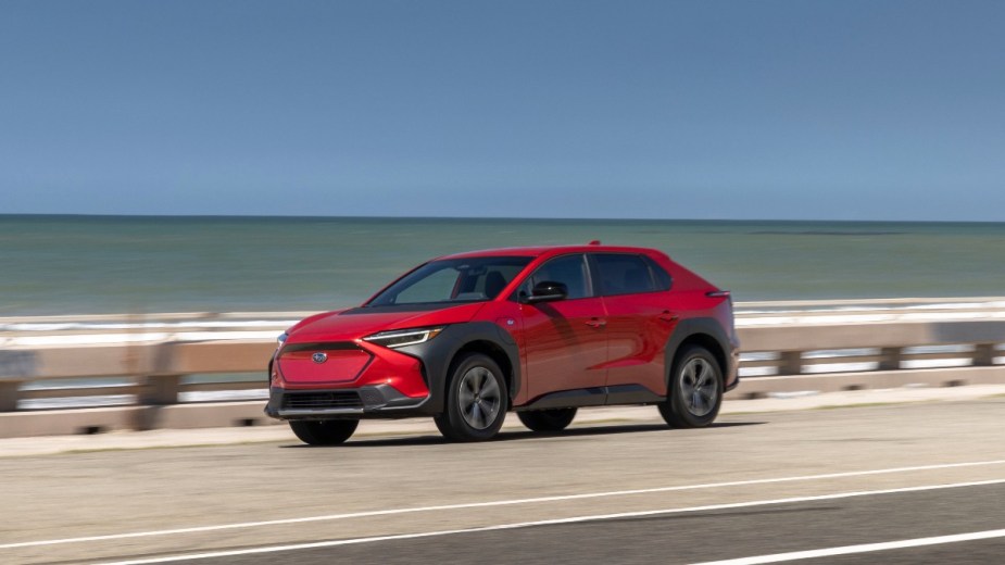 a red subaru solterra ev, an all new model for the 2023 model year