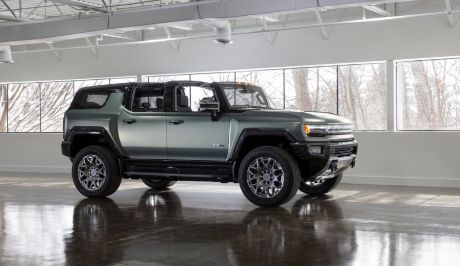 2024 GMC Hummmer EV in green in a showroom