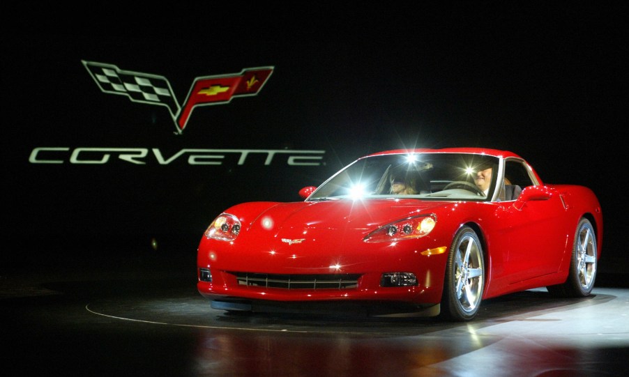 A red 2005 C6 Chevrolet Corvette on stage at NAIAS 2004