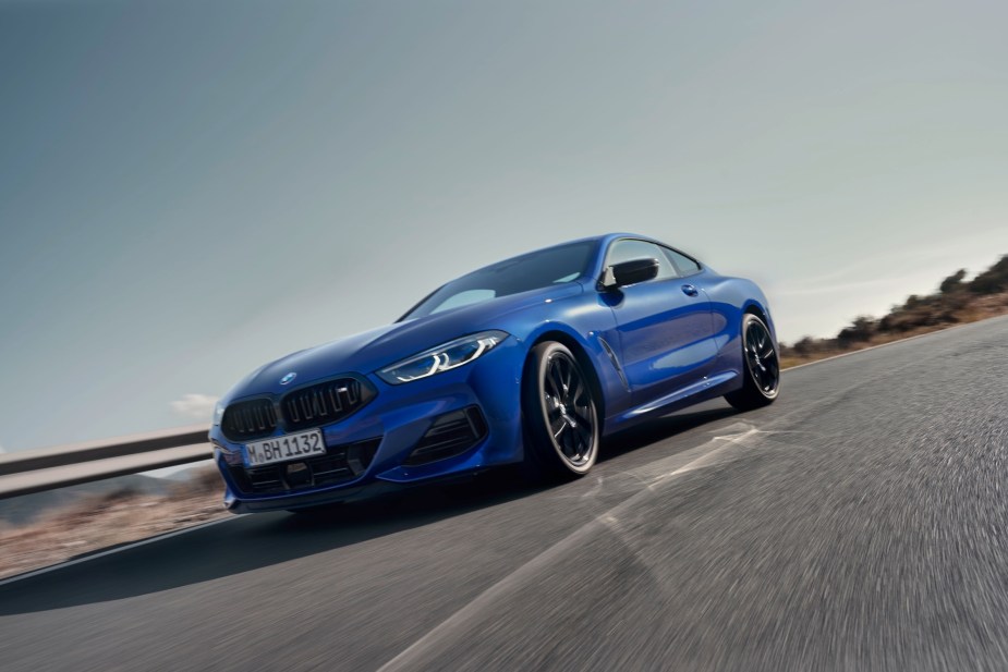 A blue BMW M850i xDrive Coupé on the highway