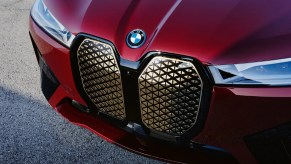 A red 2023 BMW iX luxury electric SUV.