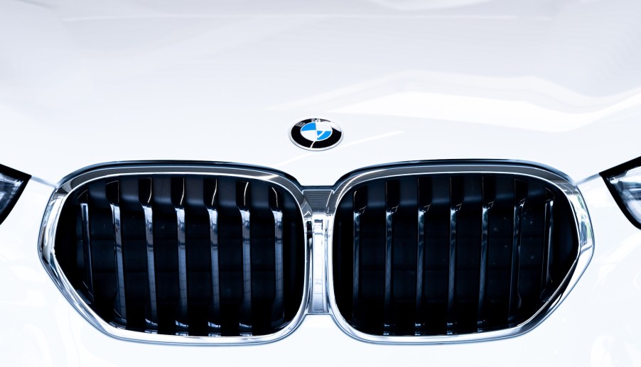 A white car boasting the BMW logo from the BMW group.