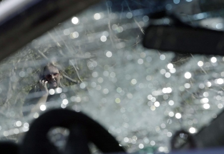 A broken windshield, potentially a windshield to spontaneously break through various means like heat.