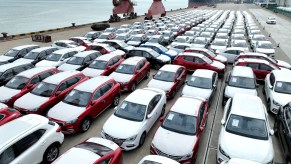 A variety of parked cars with VINs.