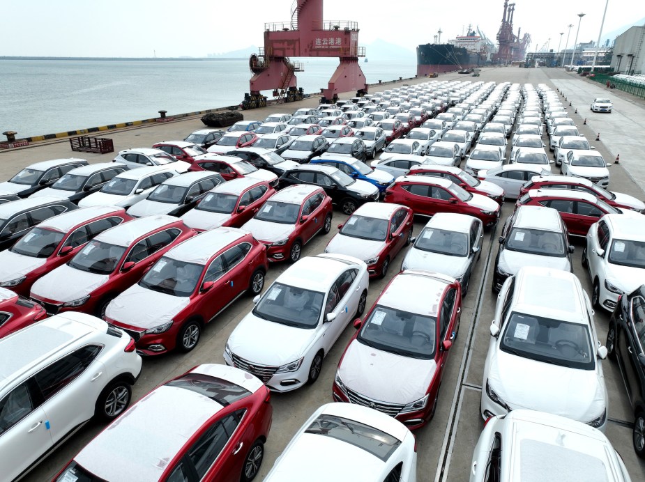 A variety of parked cars with VINs. 