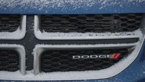 The Dodge logo covered in snow seen in Edmonton, Alberta, Canada