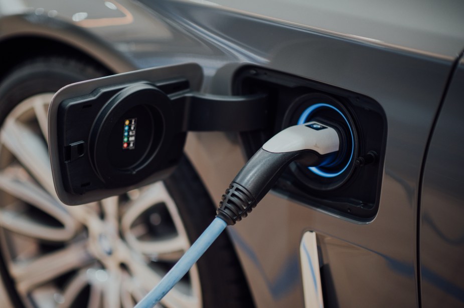 An EV plugged in at an EV charging station