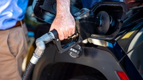 Car being filled with gas where you can pump your own gas.