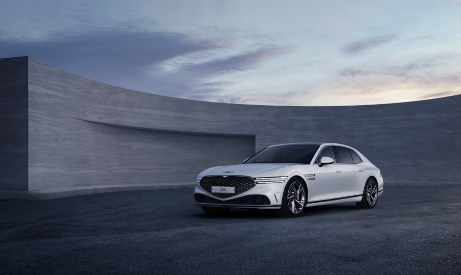 A white 2023 Genesis G90 parked