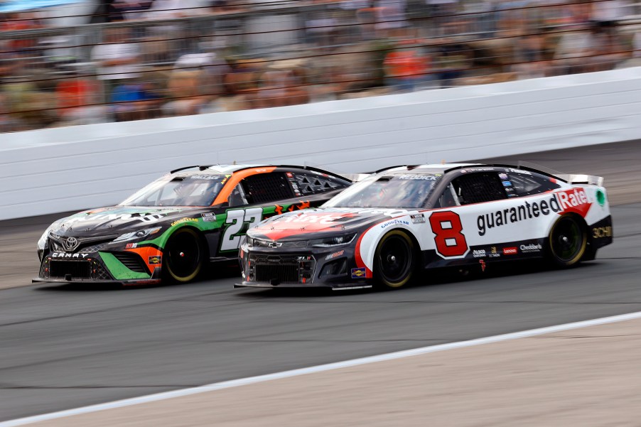 two NASCAR racers racing