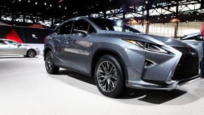 a silver Lexus RX at an auto show