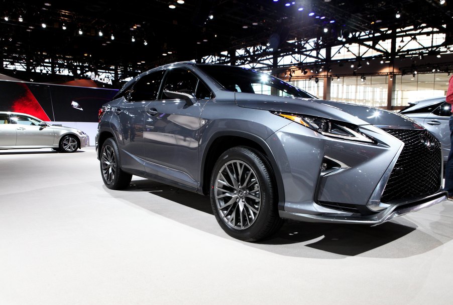 a silver Lexus RX at an auto show