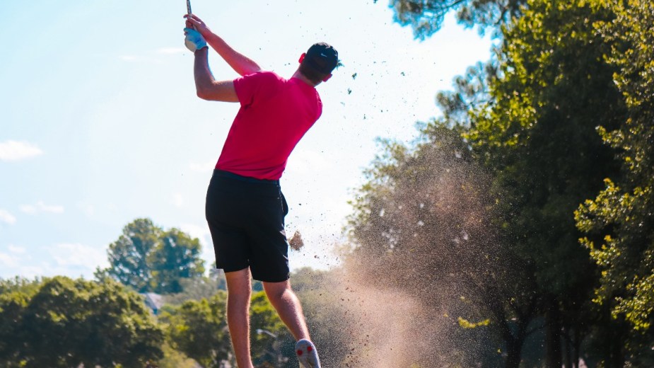 a golfer hitting a shot on course who can have a better day with a new car