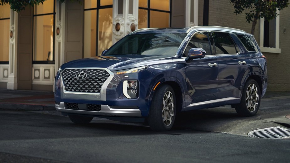 2022 Hyundai Palisade parked on the street. Is the midsize three-row SUV worth the money?