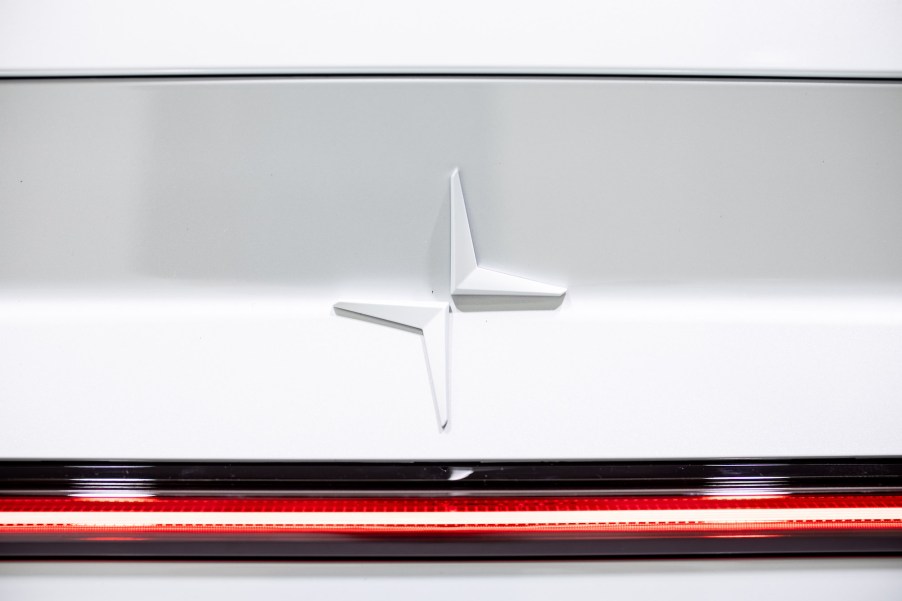 A white Polestar, maker of the Polestar two logo.