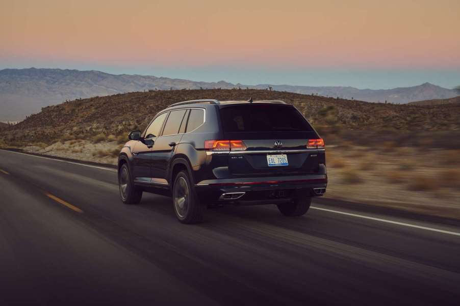 Rear angle view of black Front angle view of black 2023 VW Atlas midsize SUV, highlighting its release date and price