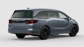 Rear angle view of gray 2023 Honda Odyssey