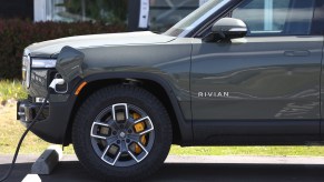 A Rivian charging outdoors.