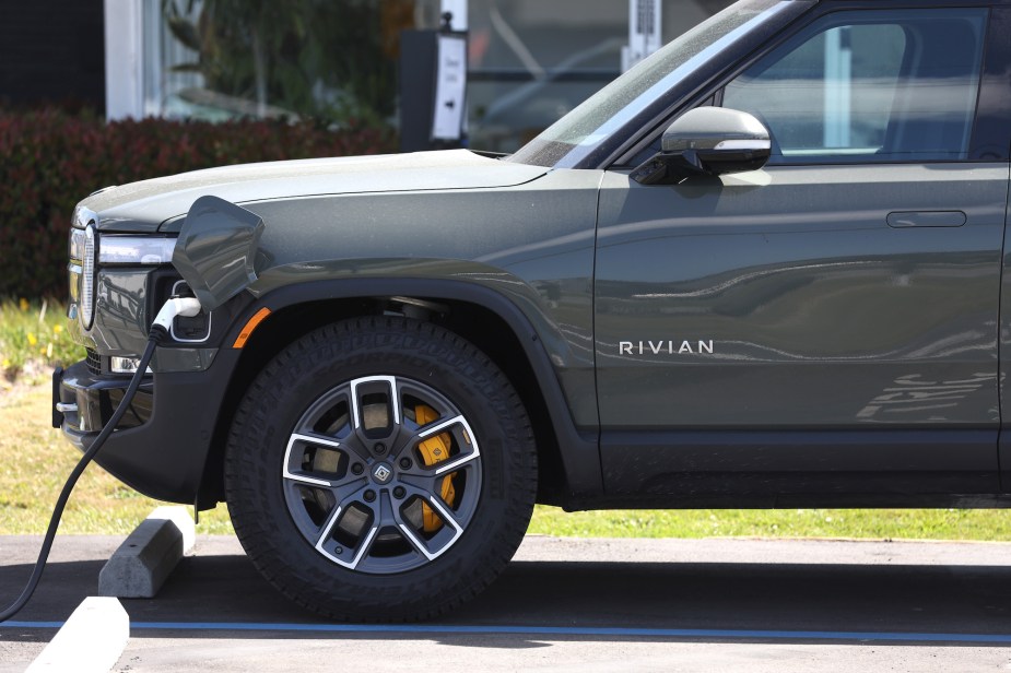 A Rivian charging outdoors. 