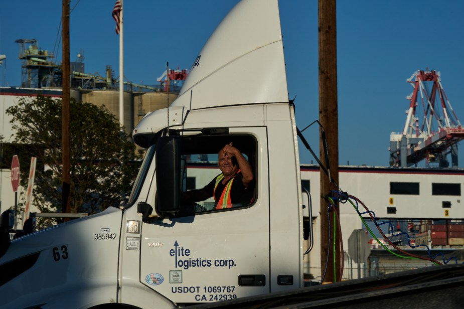 A truck drivers, potentially a truck driver can have passengers. 