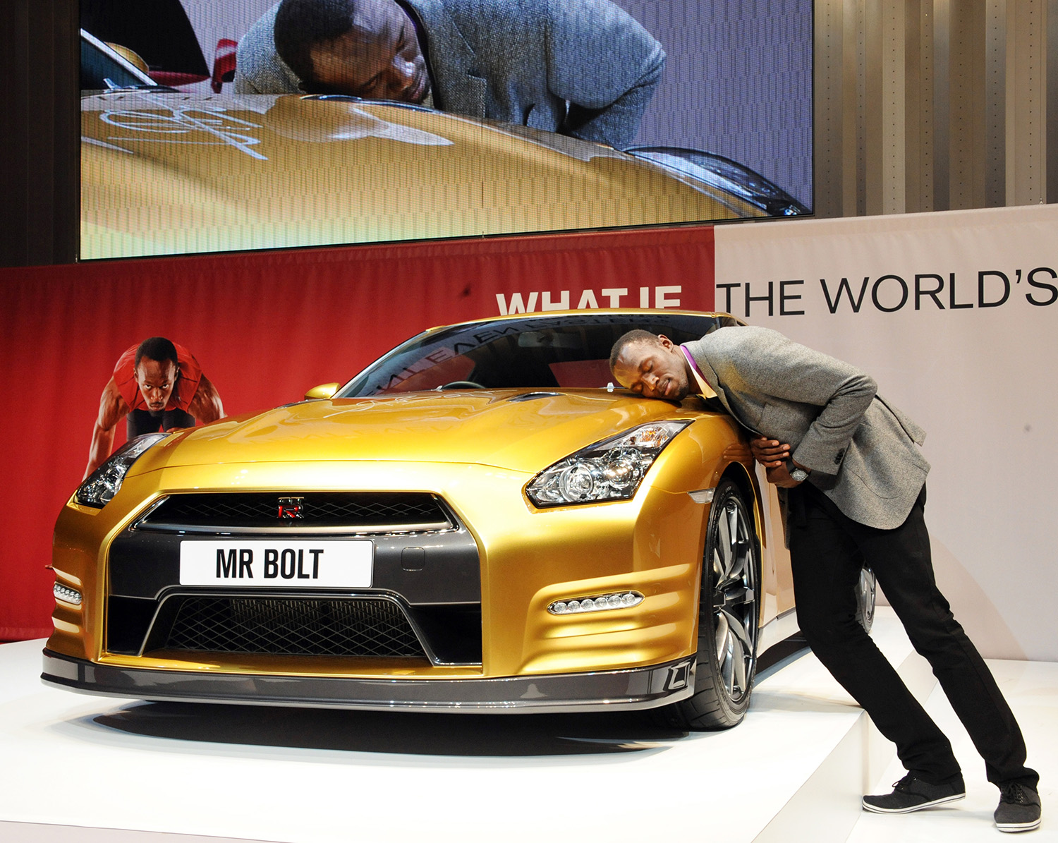 Usain Bolt with Rare Gold Nissan GTR from Car Collection at Nissan's headquarters in Yokohama