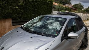 car driving hailstorm