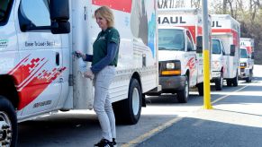 A lineup of U-Haul trucks being disinfected in Reading, Pennsylvania