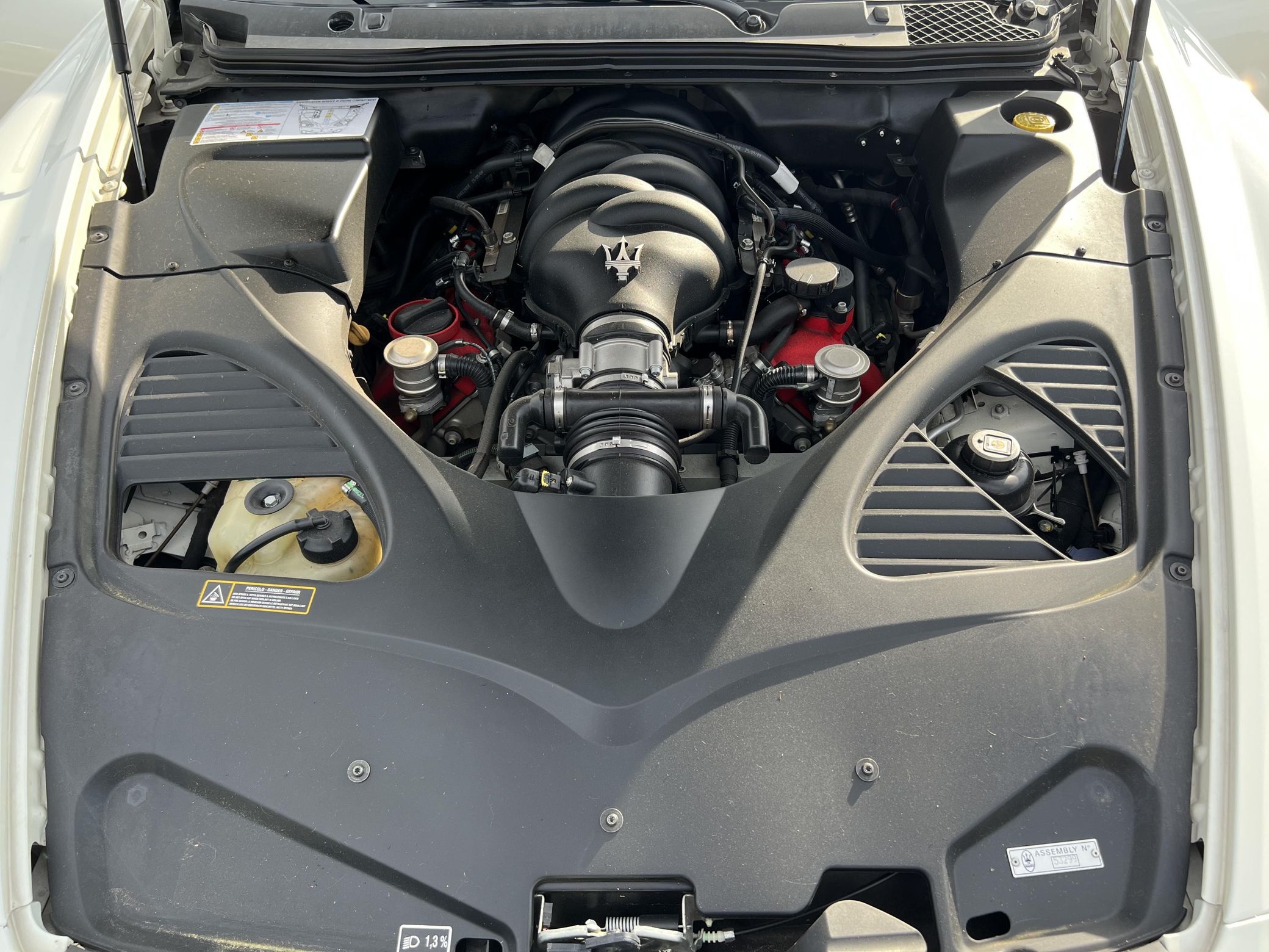 The 4.7-liter V8 in a white 2010 Maserati Quattroporte S' black-colored engine bay