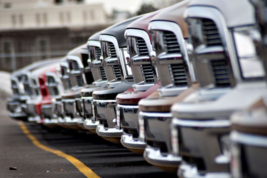 Dodge Ram pickup trucks at a Chrysler Dodge Jeep dealership in Peoria, Illinois