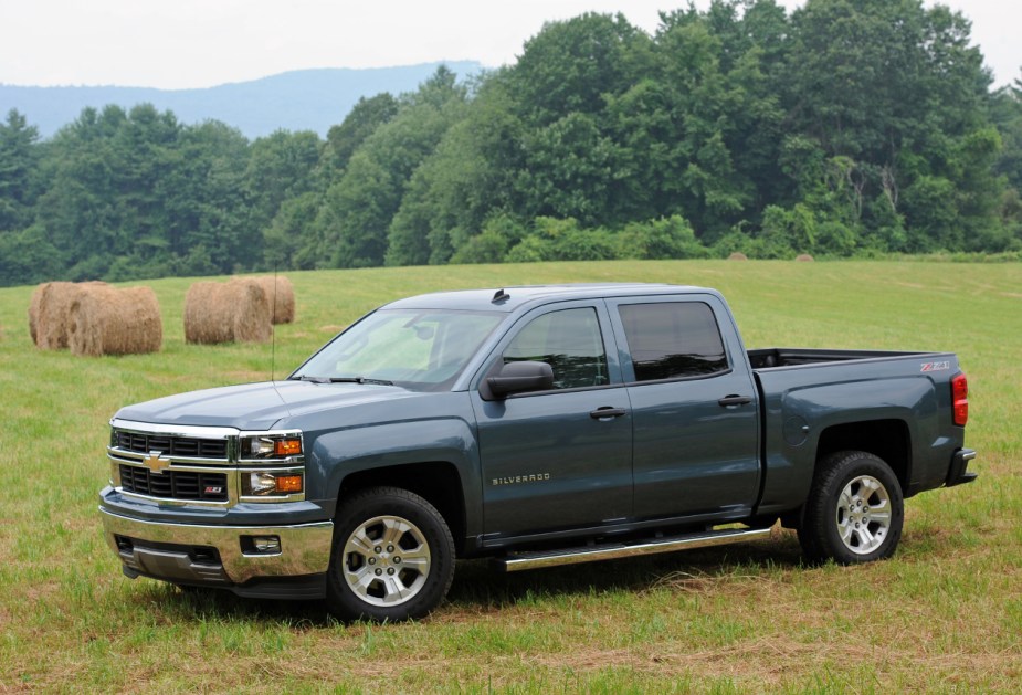 A grey third-gen Chevy Silverado 1500 sits parked in a field.